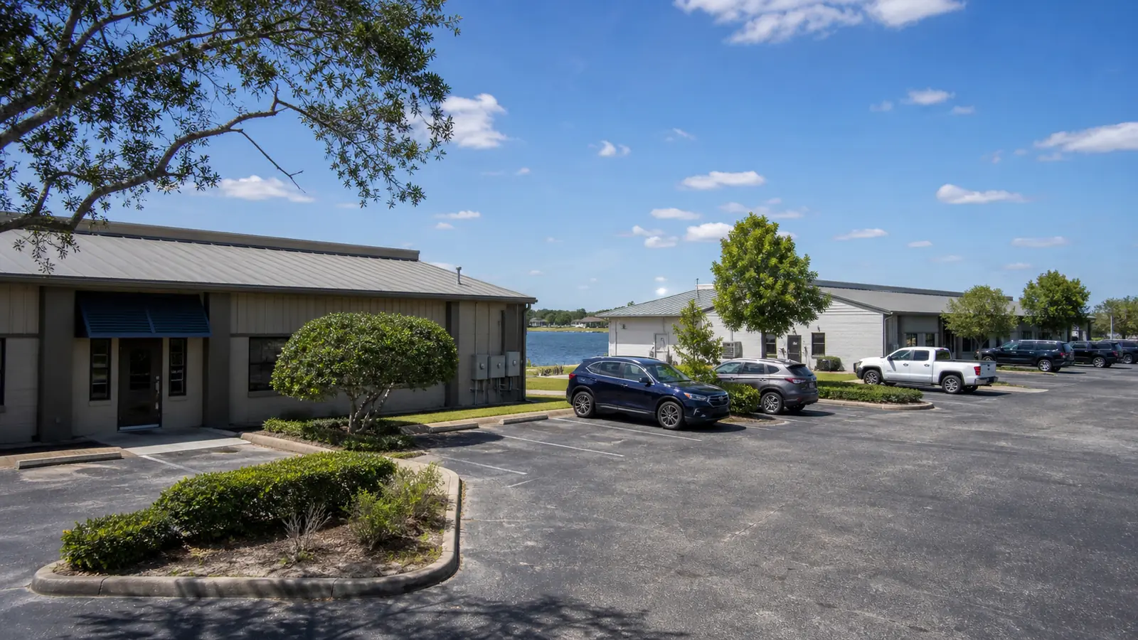 Representative Dundee-area lakeside commercial cluster with paved parking and a working local business setting